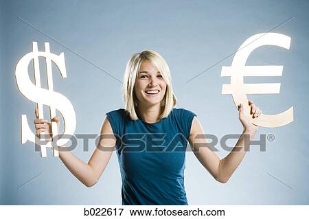 woman holding up currency symbols View Large Photo Image Stock Photo - woman holding up currency symbols. Fotosearch