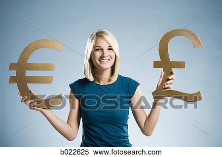 woman holding up currency symbols View Large Photo Image Stock Photography - woman holding up currency symbols. Fotosearch