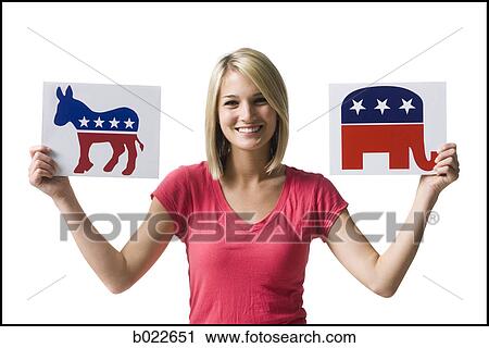 woman holding up political party signs View Large Photo Image Stock Image - woman holding up political party signs. Fotosearch
