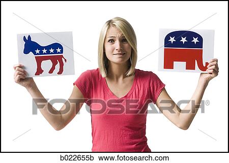 woman holding up political party signs View Large Photo Image Stock Image - woman holding up political party signs. Fotosearch