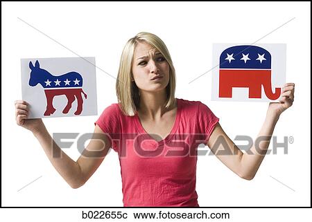 woman holding up political party signs View Large Photo Image Stock Image - woman holding up political party signs. Fotosearch