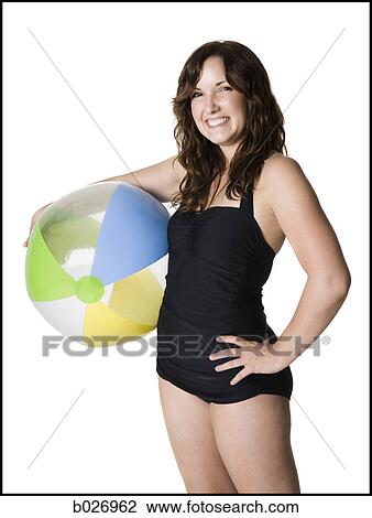 Stock Image - woman in a black swimsuit. Fotosearch