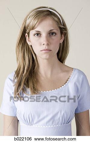 woman in a blue dress with a straight face View Large Photo Image Stock Photograph - woman in a blue dress with a straight face. Fotosearch