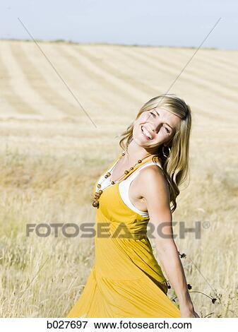 woman in a field View Large Photo Image Stock Photo - woman in a field. Fotosearch