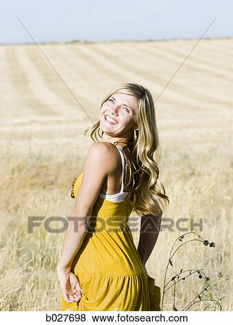 woman in a field View Large Photo Image Stock Photo - woman in a field. Fotosearch