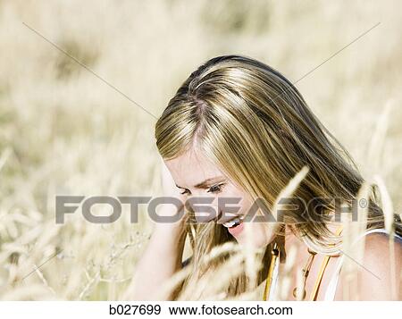 woman in a field View Large Photo Image Stock Photo - woman in a field. Fotosearch