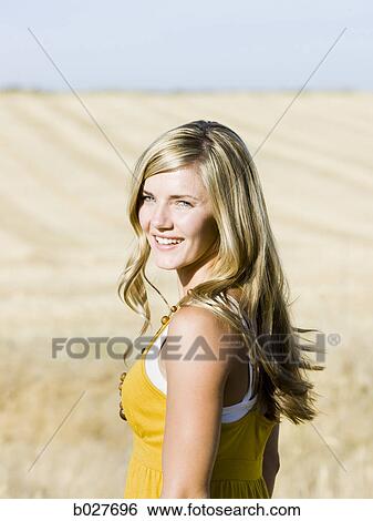 woman in a field View Large Photo Image Stock Photograph - woman in a field. Fotosearch
