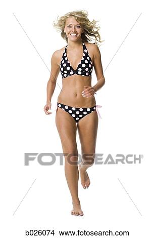 Picture - woman in a polka dot bikini. Fotosearch
