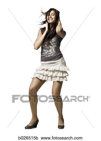 Stock Image - woman in a skirt dancing. Fotosearch