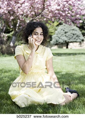 woman in a yellow dress on the phone View Large Photo Image Stock Photo - woman in a yellow dress on the phone. Fotosearch