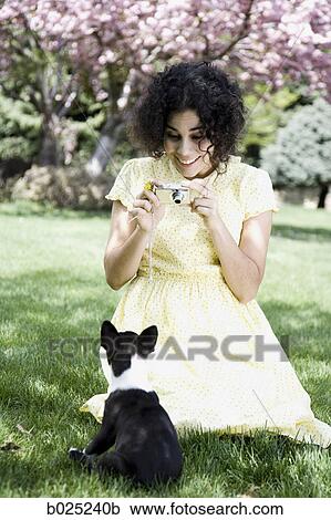 woman in a yellow dress taking photos View Large Photo Image Stock Image - woman in a yellow dress taking photos. Fotosearch