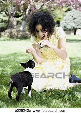 woman in a yellow dress taking photos View Large Photo Image Stock Image - woman in a yellow dress taking photos. Fotosearch