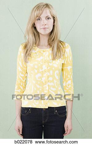 Stock Photo - woman in a yellow shirt. Fotosearch