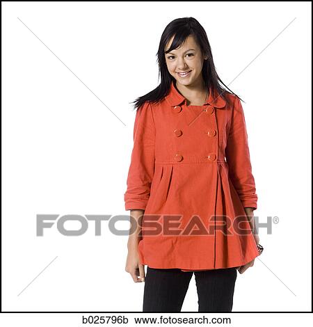 woman in an orange coat View Large Photo Image Stock Image - woman in an orange coat. Fotosearch