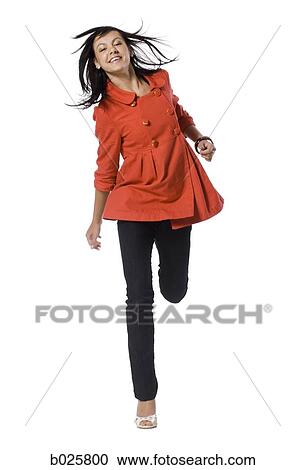 woman in an orange coat View Large Photo Image Stock Image - woman in an orange coat. Fotosearch