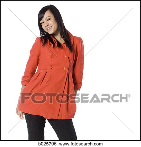 woman in an orange coat View Large Photo Image Stock Photograph - woman in an orange coat. Fotosearch