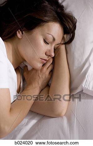 Stock Image - woman in bed. Fotosearch