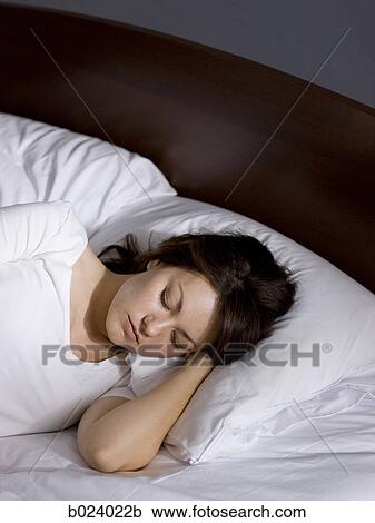 Stock Image - woman in bed. Fotosearch