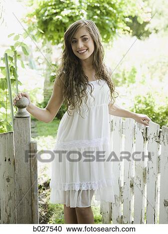 woman in the garden in a summer dress View Large Photo Image Stock Image - woman in the garden in a summer dress. Fotosearch