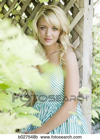 woman in the garden in a summer dress View Large Photo Image Stock Image - woman in the garden in a summer dress. Fotosearch