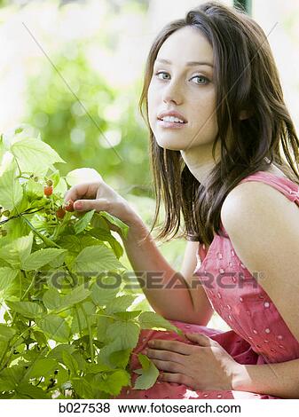 woman in the garden in a summer dress View Large Photo Image Stock Photo - woman in the garden in a summer dress. Fotosearch