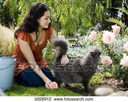 woman in the garden View Large Photo Image Stock Image - woman in the garden. Fotosearch