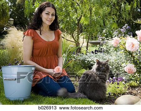 woman in the garden View Large Photo Image Stock Image - woman in the garden. Fotosearch