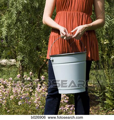 woman in the garden View Large Photo Image Stock Photograph - woman in the garden. Fotosearch