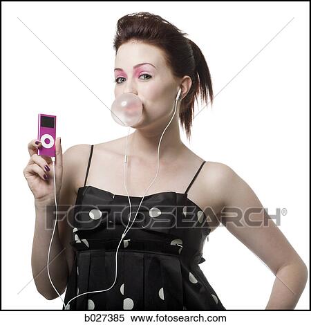 woman listening to digital music on her ipod blowing a bubble View Large Photo Image Stock Photography - woman listening to digital music on her ipod blowing a bubble. Fotosearch