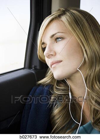 woman listening to music on a car ride View Large Photo Image Stock Image - woman listening to music on a car ride. Fotosearch