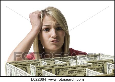 woman looking at a maze made of dollars View Large Photo Image Picture - woman looking at a maze made of dollars. Fotosearch