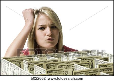 woman looking at a maze made of dollars View Large Photo Image Stock Image - woman looking at a maze made of dollars. Fotosearch