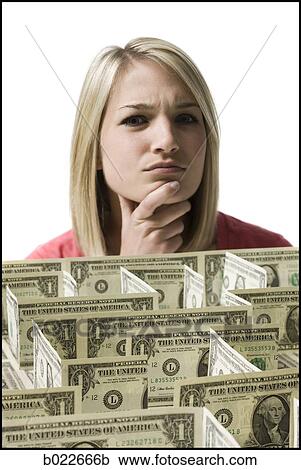 woman looking at a maze made of dollars View Large Photo Image Stock Image - woman looking at a maze made of dollars. Fotosearch
