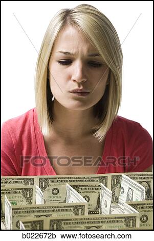 woman looking at a maze made of dollars View Large Photo Image Stock Image - woman looking at a maze made of dollars. Fotosearch