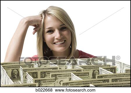 woman looking at a maze made of dollars View Large Photo Image Stock Photo - woman looking at a maze made of dollars. Fotosearch