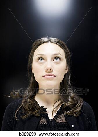 Stock Photo - woman looking up. Fotosearch