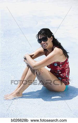 woman lying down in the water View Large Photo Image Stock Image - woman lying down in the water. Fotosearch