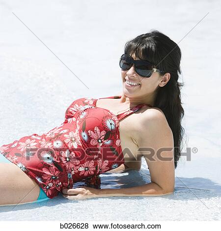 woman lying down in the water View Large Photo Image Stock Photo - woman lying down in the water. Fotosearch