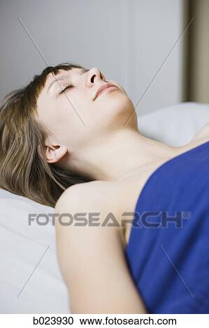 Stock Image - woman lying on a massage table. Fotosearch