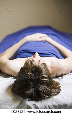 Stock Photo - woman lying on a massage table. Fotosearch