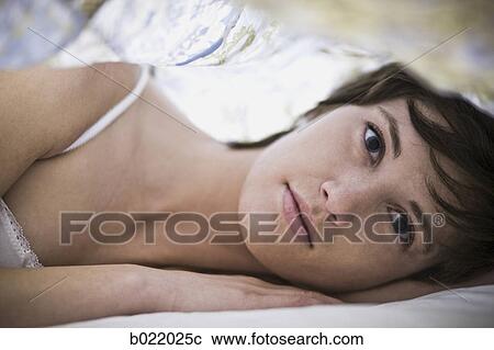 woman lying on her side View Large Photo Image Stock Image - woman lying on her side. Fotosearch