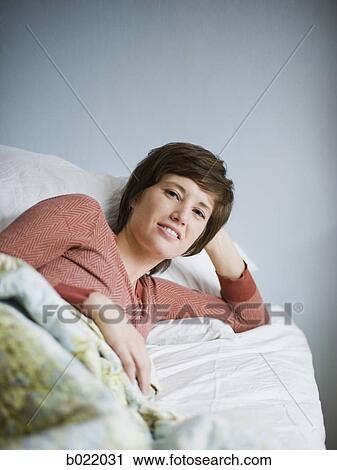 woman lying on her side View Large Photo Image Stock Image - woman lying on her side. Fotosearch