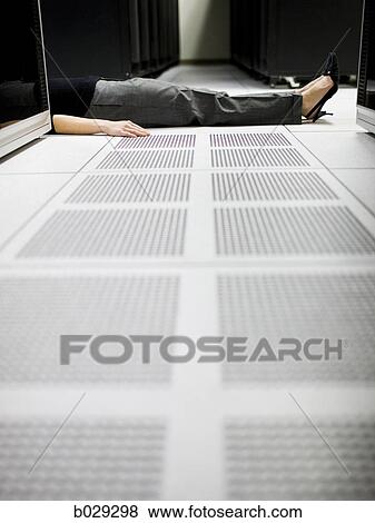 woman lying on the floor of a server room View Large Photo Image Stock Photo - woman lying on the floor of a server room. Fotosearch