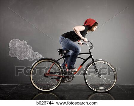 woman on a bicycle View Large Photo Image Picture - woman on a bicycle. Fotosearch