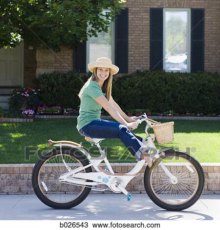 woman on a bicycle View Large Photo Image Stock Image - woman on a bicycle. Fotosearch