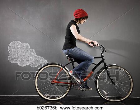 woman on a bicycle View Large Photo Image Stock Image - woman on a bicycle. Fotosearch