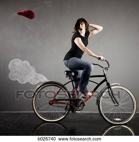 Stock Image - woman on a bicycle. Fotosearch