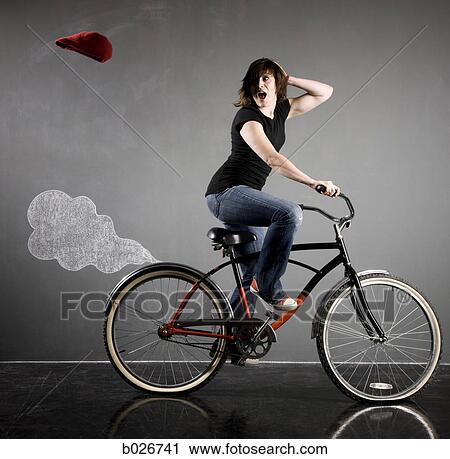 woman on a bicycle View Large Photo Image Stock Image - woman on a bicycle. Fotosearch