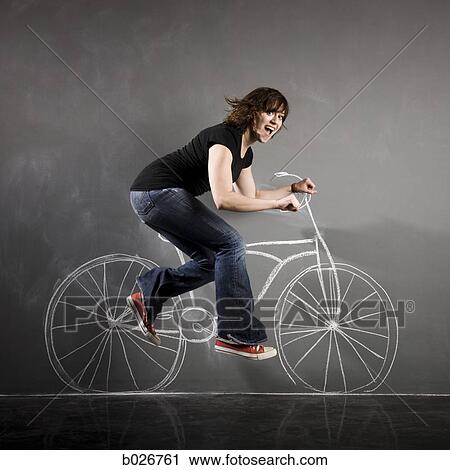 woman on a bicycle View Large Photo Image Stock Image - woman on a bicycle. Fotosearch