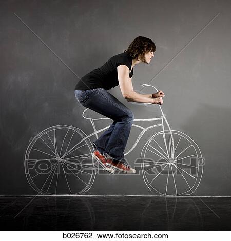 Stock Image - woman on a bicycle. Fotosearch